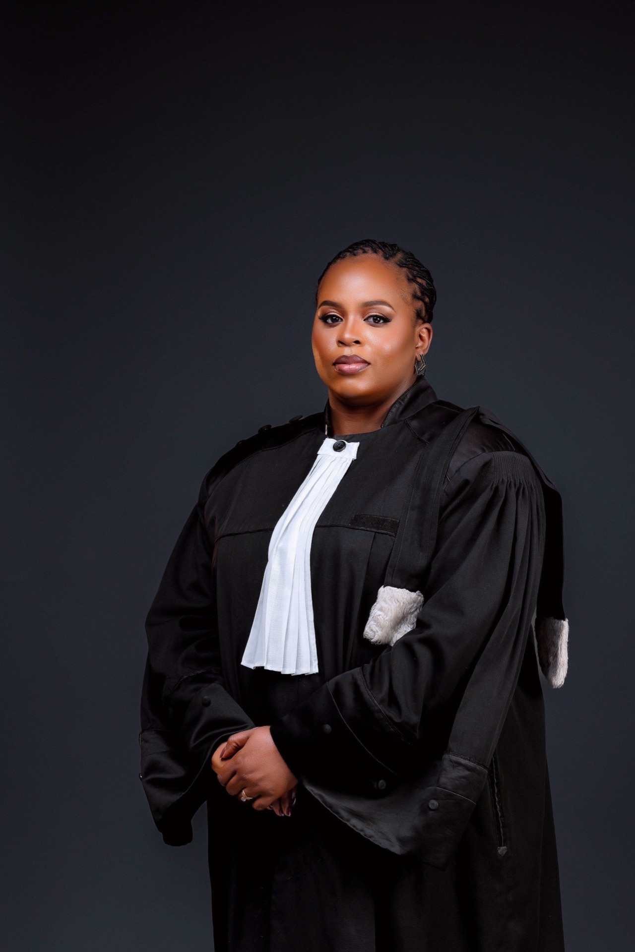 Me. Nyembo C. Eméline in legal robe, Founder & Managing Partner of Shebah Law Firm